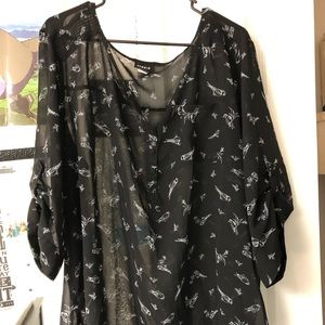 Black and white birds on a sheer blouse